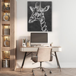 a home office with a giraffe painting on the wall