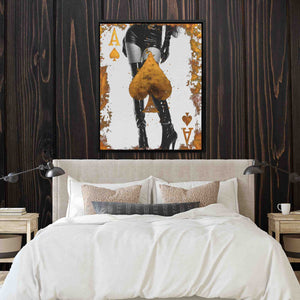 a bed in a bedroom with a painting on the wall