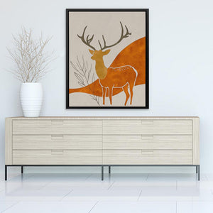 a picture of a deer on a wall above a dresser