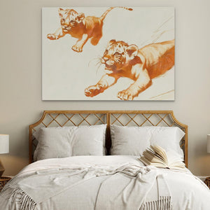 a painting of two tigers on a wall above a bed