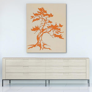 a painting of a tree on a wall above a dresser