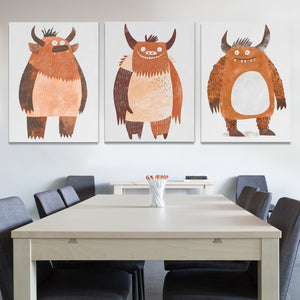 a dining room table with chairs and two paintings on the wall