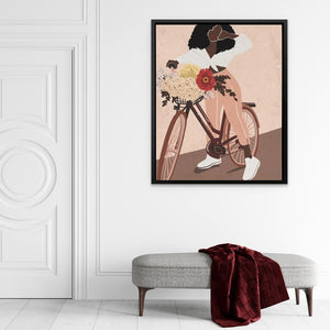 a picture of a woman riding a bike with flowers in the basket