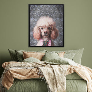 a bed with a green comforter and a picture of a poodle