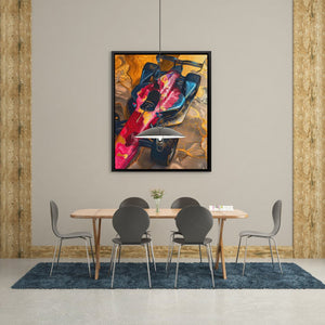 a table and chairs in a room with a painting on the wall