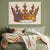 a painting of a crown on a wall above a bed