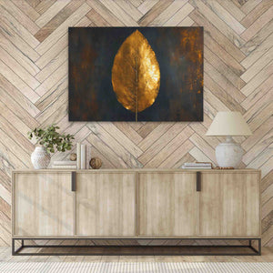 a painting of a gold leaf on a wall