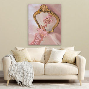 a white couch with a pink painting on the wall