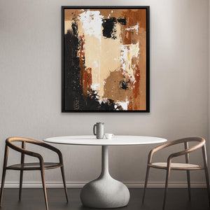 a table with two chairs and a painting on the wall