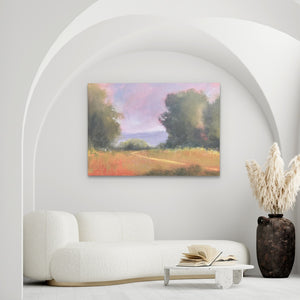 a living room with a white couch and a painting on the wall