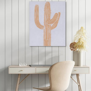 a desk with a chair and a painting on the wall