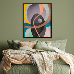 a bed with a green comforter and a painting on the wall