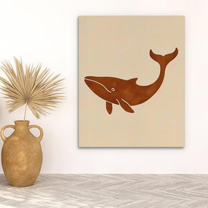a painting of a whale on a wall next to a potted plant