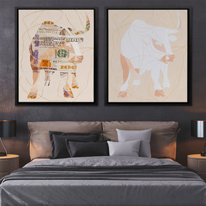 a bed with two paintings on the wall above it