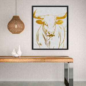 a picture of a cow on a wall above a table