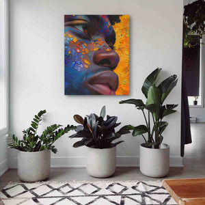 a painting of a woman's face on a wall next to potted plants
