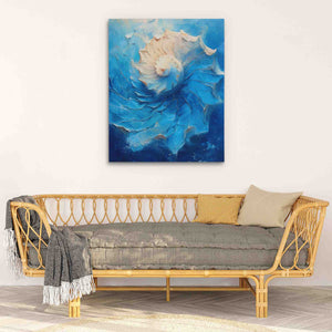 a living room with a couch and a painting on the wall