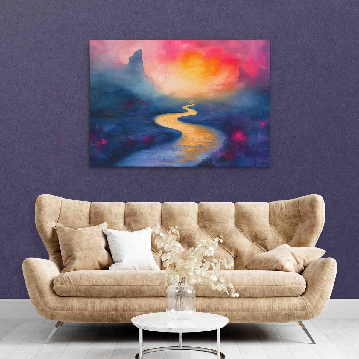 a living room with a couch and a painting on the wall