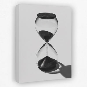 a black and white photo of an hourglass