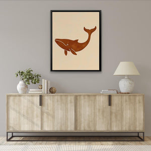 a picture of a whale on a wall above a dresser