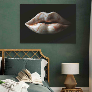 a painting of a woman's lips on a wall above a bed