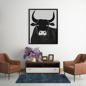 a living room with a cow on the wall