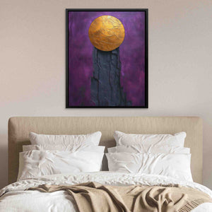 a painting of a yellow ball sitting on top of a bed