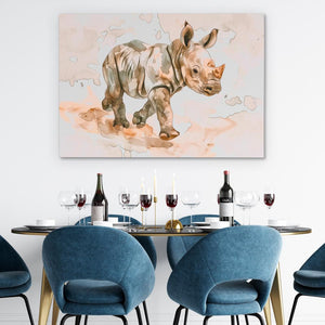 a painting of a rhino on a wall above a table