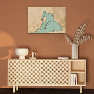 a picture of a bear on a wall above a cabinet