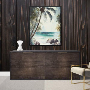 a painting of a beach scene hangs on a wall