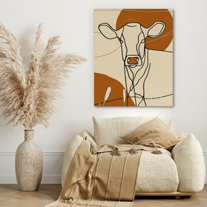 a living room with a cow painting on the wall