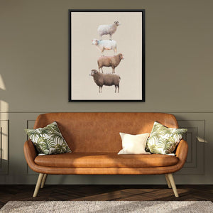 a couch in a living room with a sheep painting on the wall