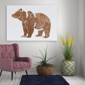 a living room with a pink chair and a brown bear on the wall