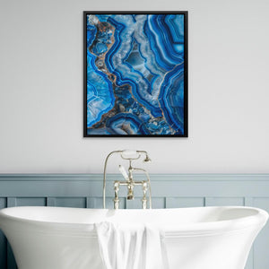 a white bath tub sitting next to a blue wall