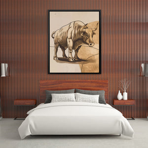 a picture of a bull on a wall above a bed