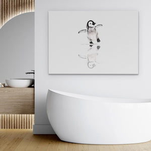 a white bath tub sitting next to a painting of a penguin