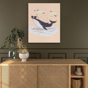 a picture of a whale on a wall above a cabinet