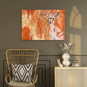 a painting of a deer on a wall next to a chair