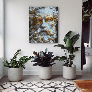 a painting of a man's face on a wall next to potted plants