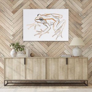 a picture of a frog on a wall above a sideboard