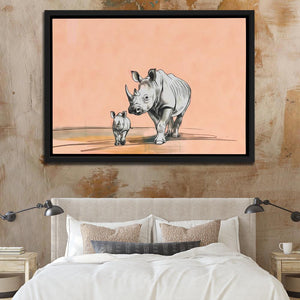 a picture of a rhino and her baby on a wall above a bed