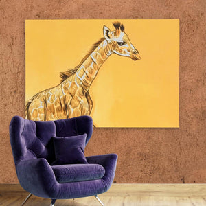 a giraffe painted on a wall next to a purple chair