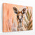 a painting of a baby giraffe looking at the camera