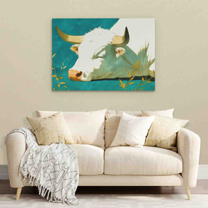 a living room with a couch and a cow painting on the wall