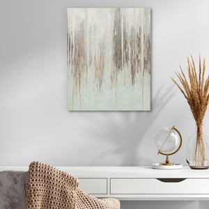 a painting hanging on a wall above a white table