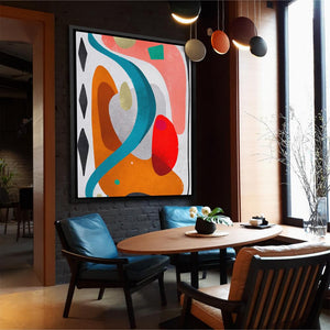 a dining room with a large painting on the wall