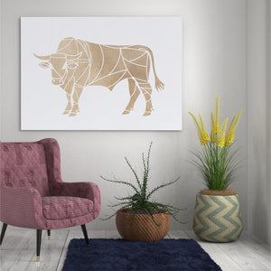 a living room with a chair and a cow artwork on the wall