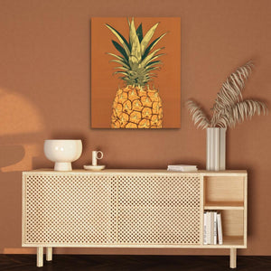 a painting of a pineapple on a brown wall