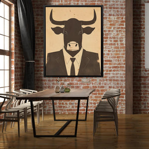 a picture of a bull in a suit hangs on a brick wall