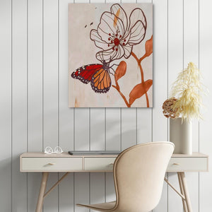 a desk with a chair and a painting on the wall